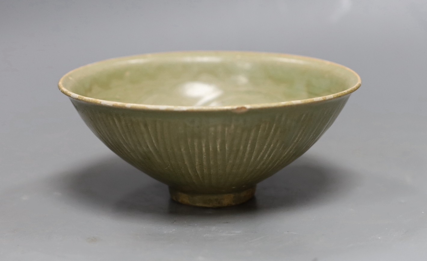 A Chinese carved Yaozhou celadon bowl, Northern Song Dynasty, 15.5cms high